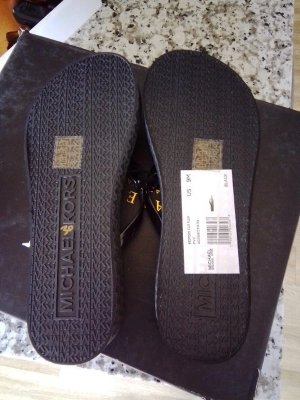 Michael Kors Black Flip Flops with Gold MK Medallions